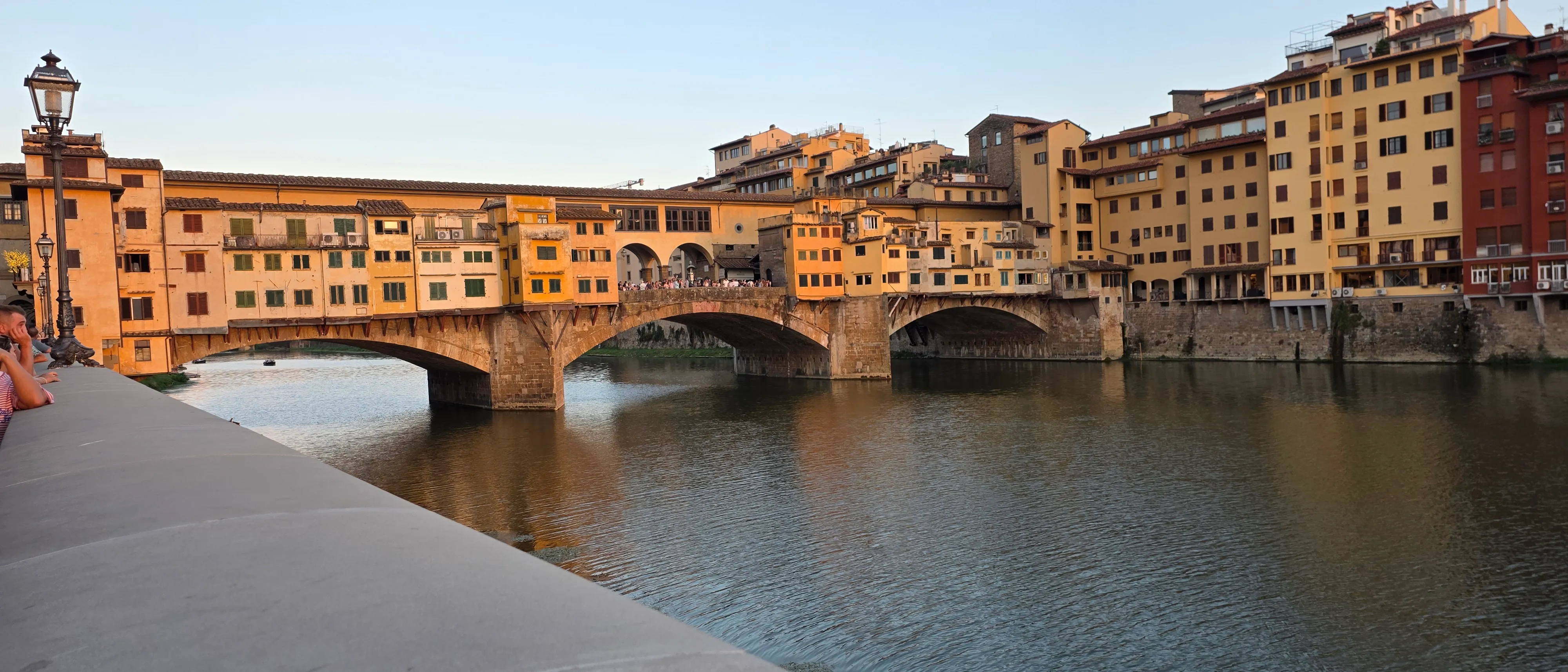 The Ponte Vecchio in golden light over the Arno in Florence