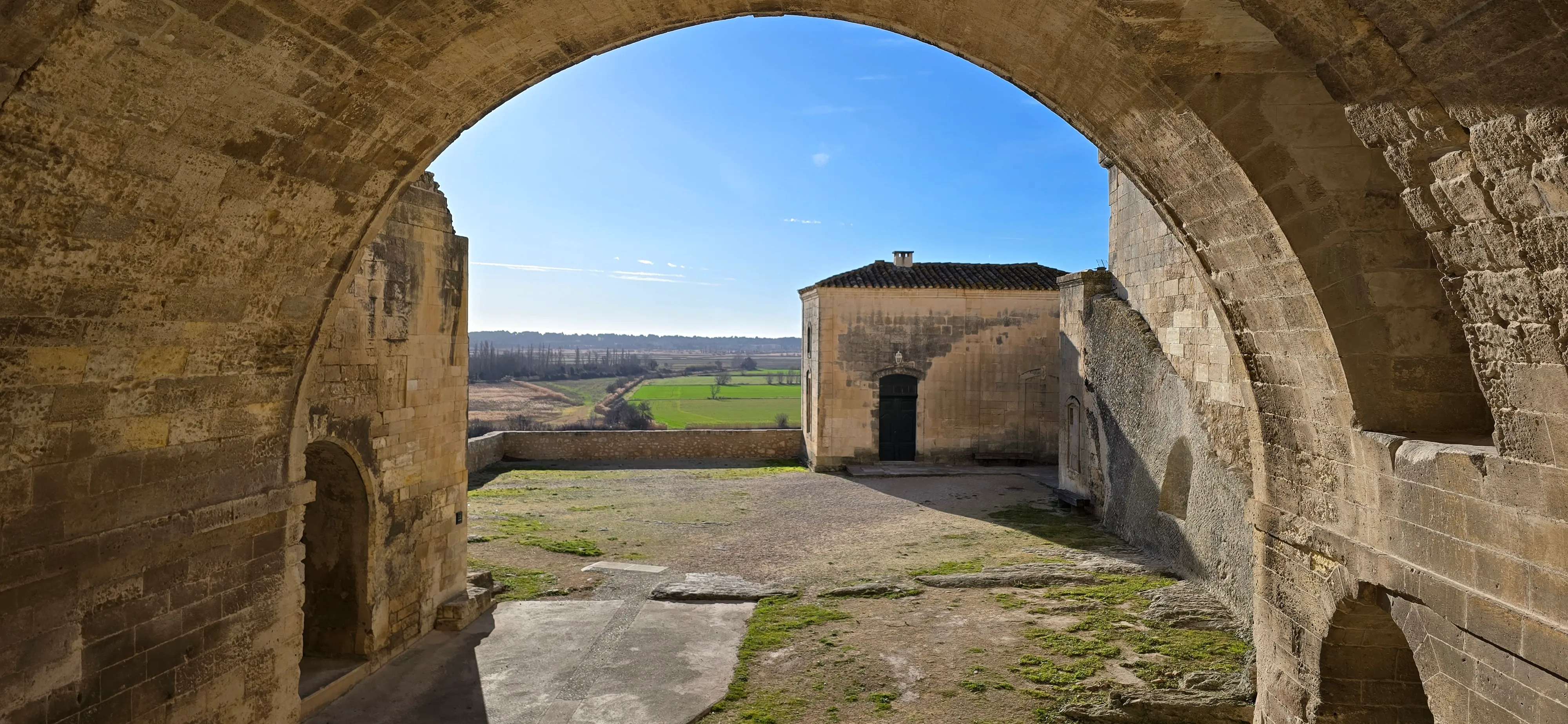 A stone arch over a courtyard